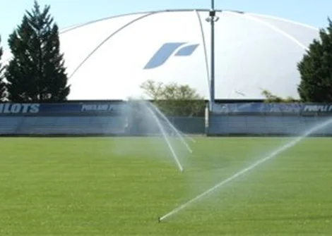 Athletic Sod Sports field with sprinklers watering the turf